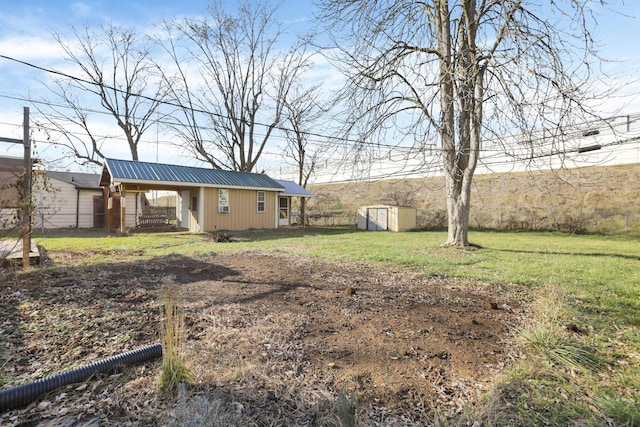 view of yard featuring a porch and a storage shed