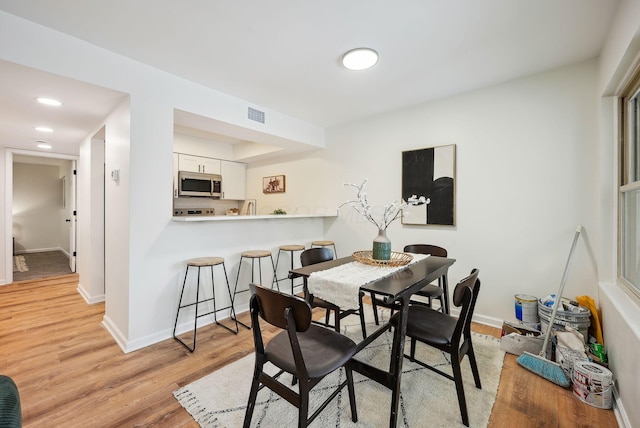 dining room with light wood-type flooring