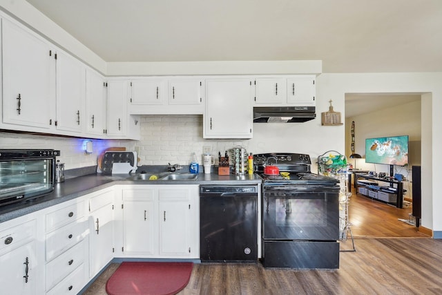 kitchen featuring decorative backsplash, sink, black appliances, wood-type flooring, and white cabinets