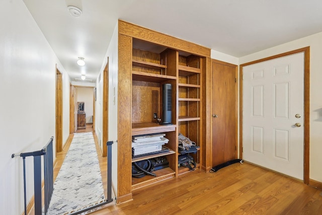 hall with wood-type flooring