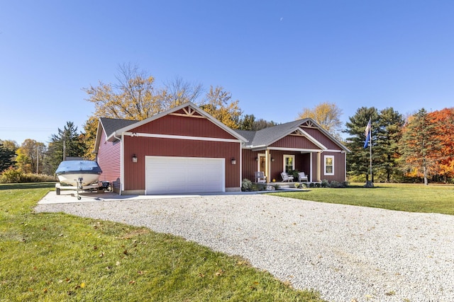 view of front of house featuring a front yard and a garage