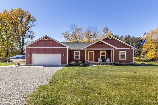 view of front of property featuring a front yard and a garage