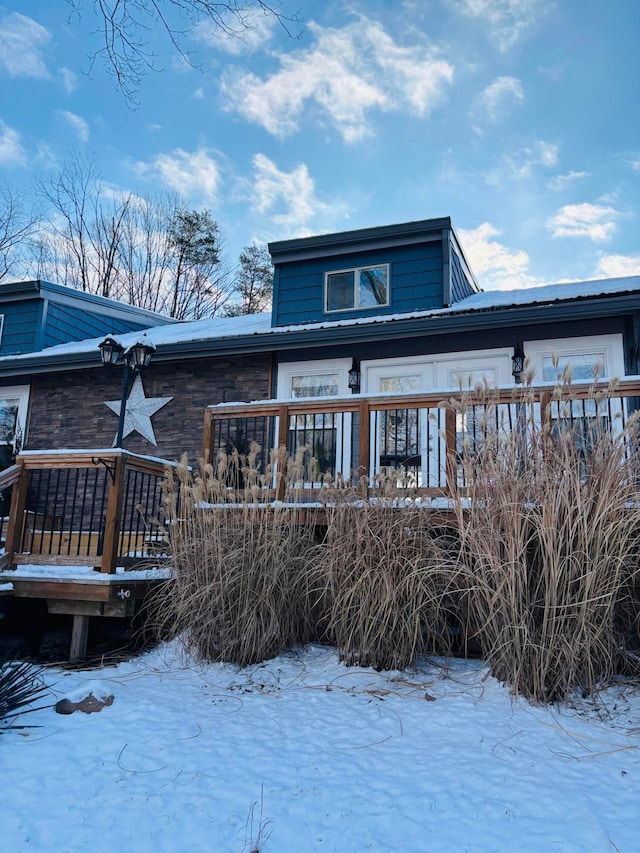 view of front of property with a wooden deck