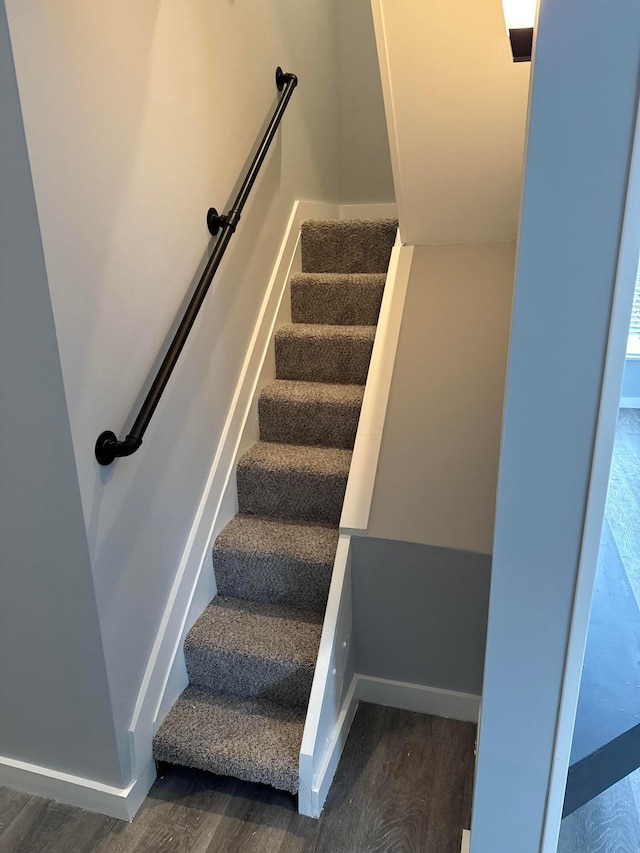 staircase featuring hardwood / wood-style flooring