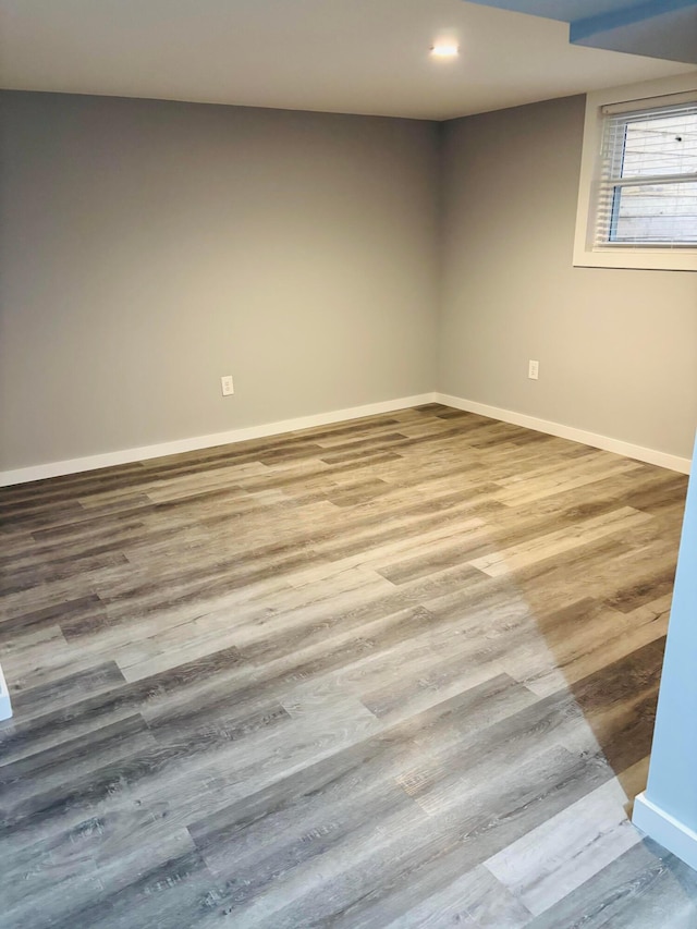 spare room with hardwood / wood-style floors