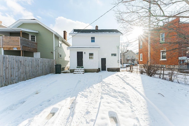 view of snow covered house