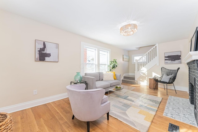 living room featuring a fireplace and hardwood / wood-style flooring