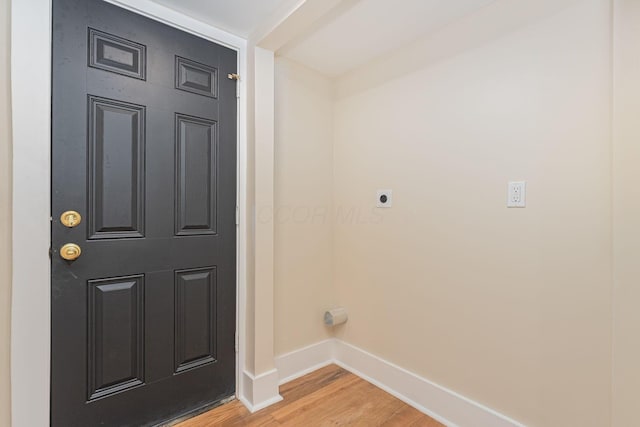 laundry room featuring hookup for an electric dryer and hardwood / wood-style floors