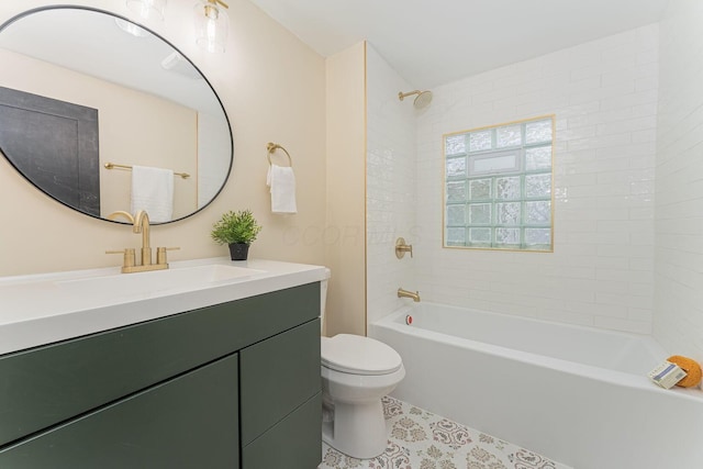 full bathroom featuring vanity, tiled shower / bath combo, and toilet