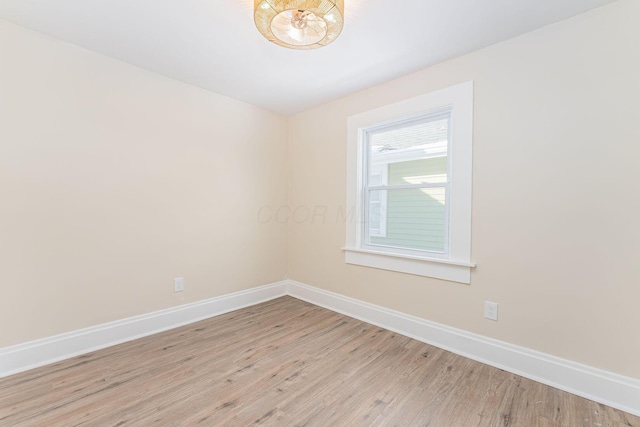 spare room featuring light hardwood / wood-style flooring