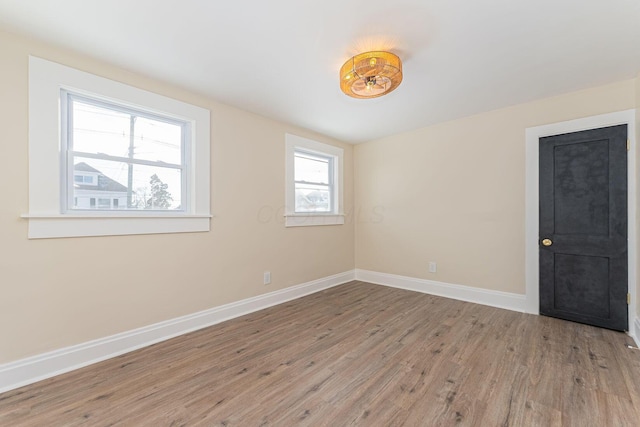 spare room featuring light hardwood / wood-style floors