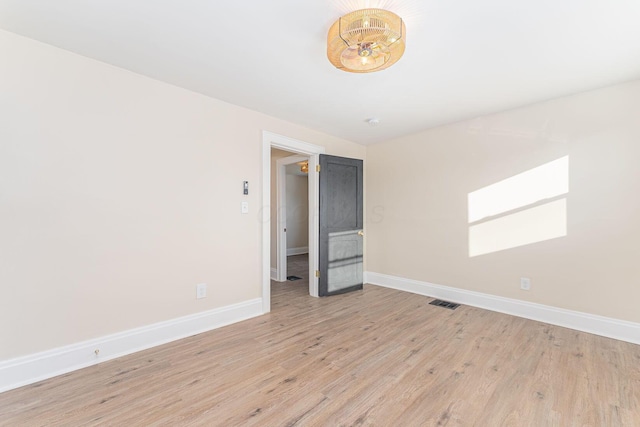 unfurnished room featuring light wood-type flooring