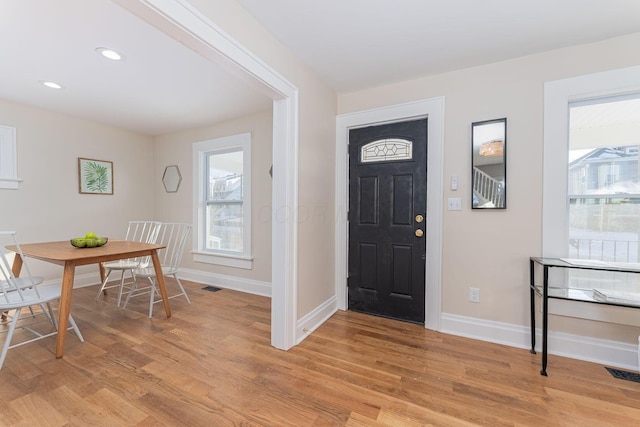 foyer entrance featuring light hardwood / wood-style flooring