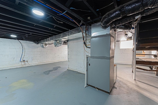 basement featuring heating unit