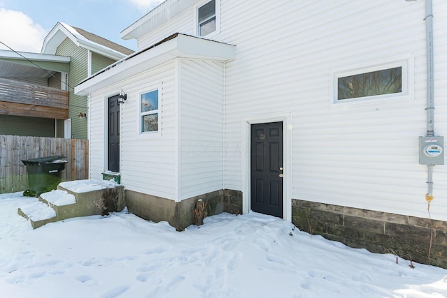 view of snow covered property entrance