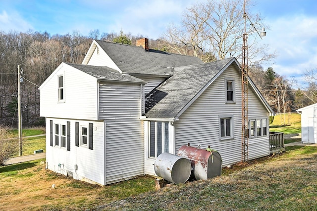 back of house with a yard