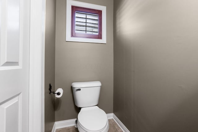 bathroom featuring tile patterned floors and toilet