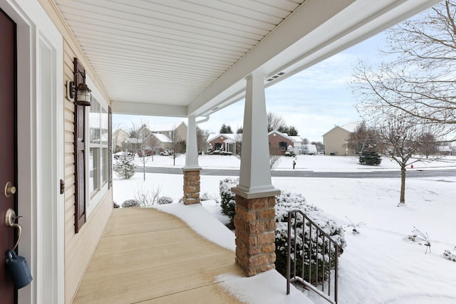 view of snow covered patio