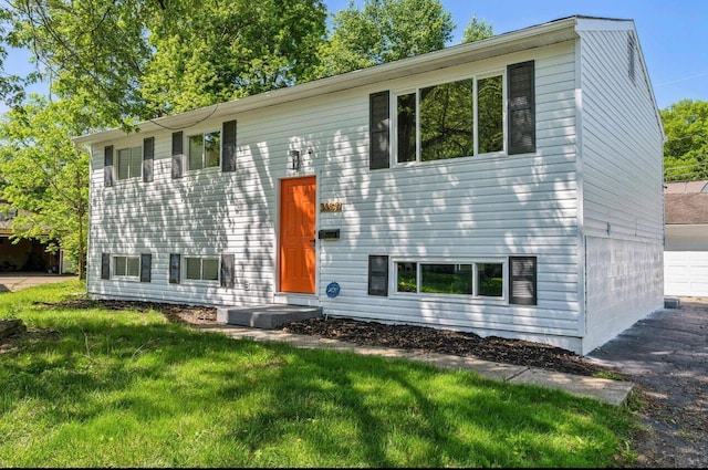 bi-level home with a front yard