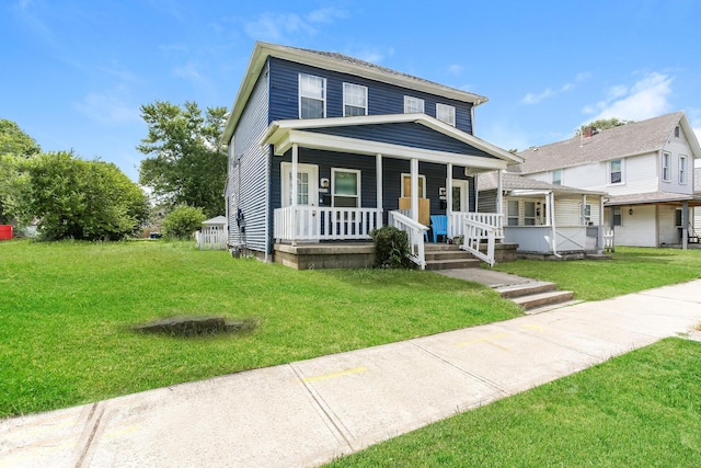 view of front of house featuring covered porch and a front yard