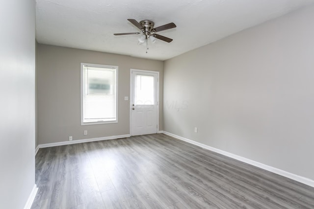 unfurnished room featuring ceiling fan and wood-type flooring