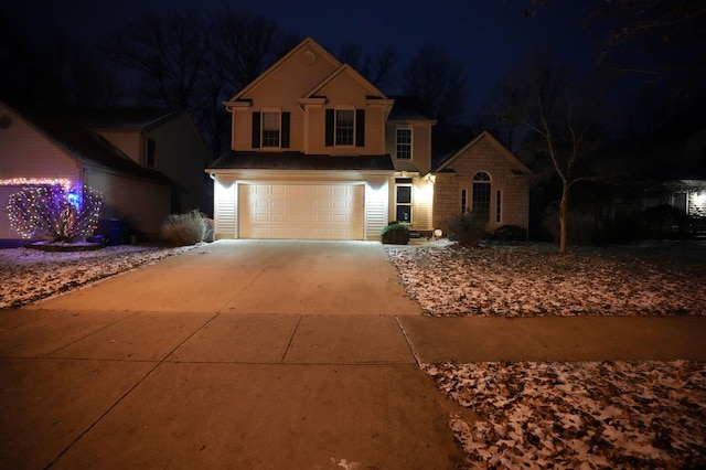 front of property with a garage