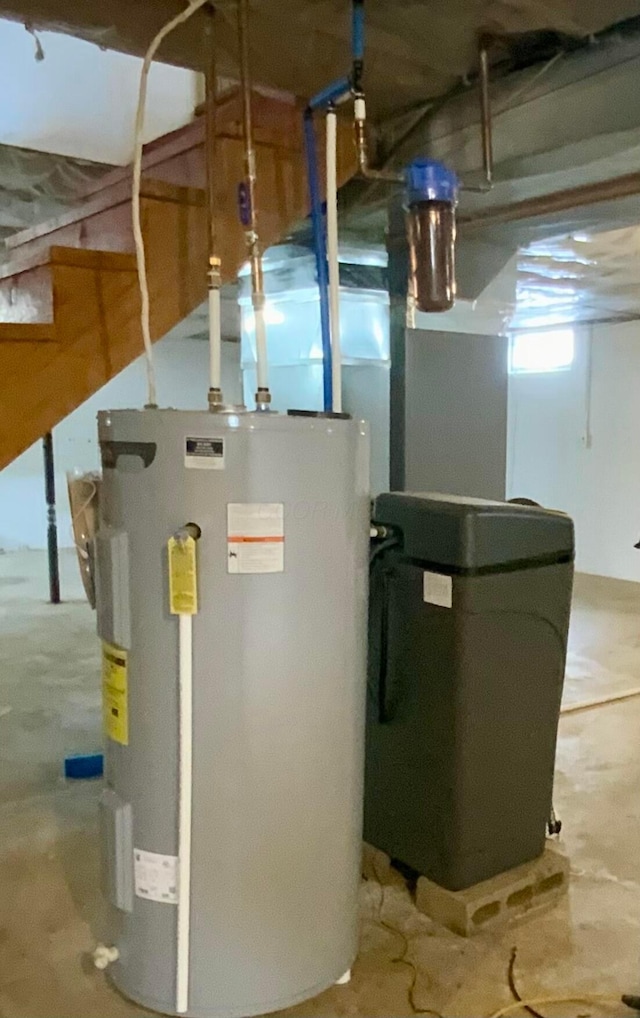 utility room featuring electric water heater