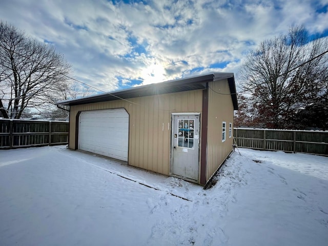 view of snow covered garage