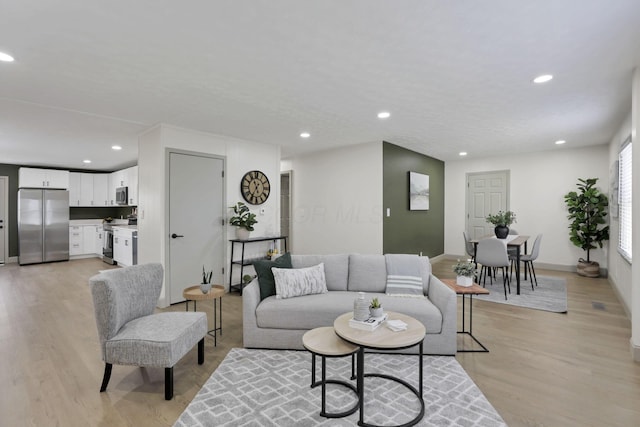 living room with light hardwood / wood-style flooring