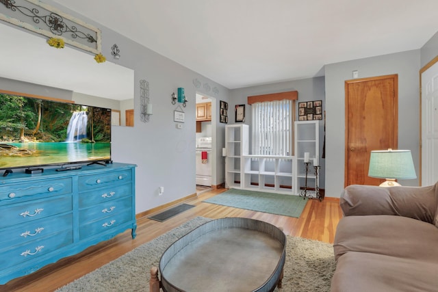 living room with light hardwood / wood-style floors