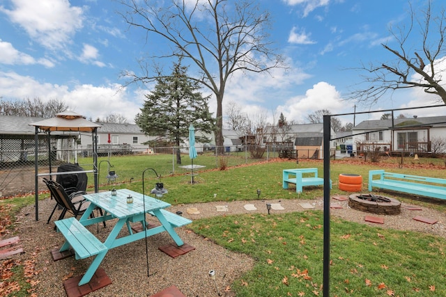 exterior space with a gazebo and an outdoor fire pit