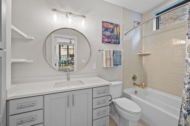 full bathroom featuring vanity, shower / bath combination with curtain, and toilet