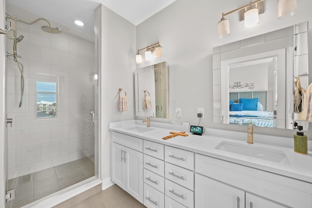 bathroom featuring vanity, tile patterned floors, and an enclosed shower