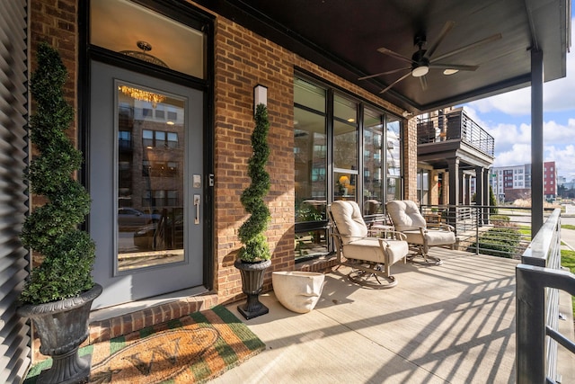 exterior space with a porch and ceiling fan