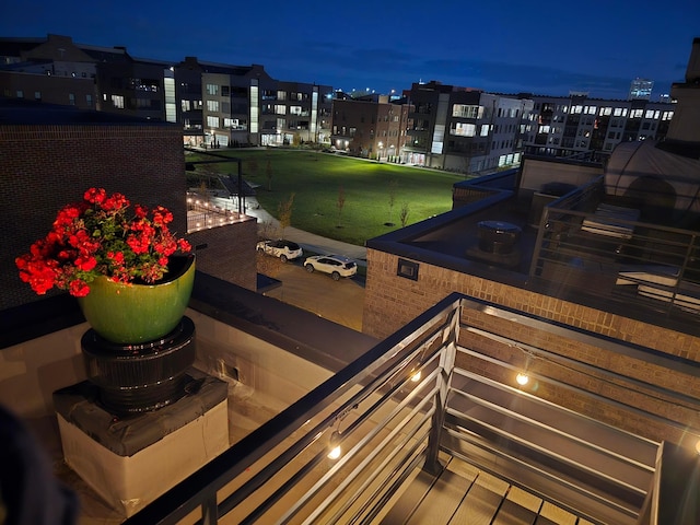 view of balcony at twilight