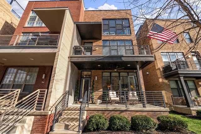 view of front of house featuring a balcony