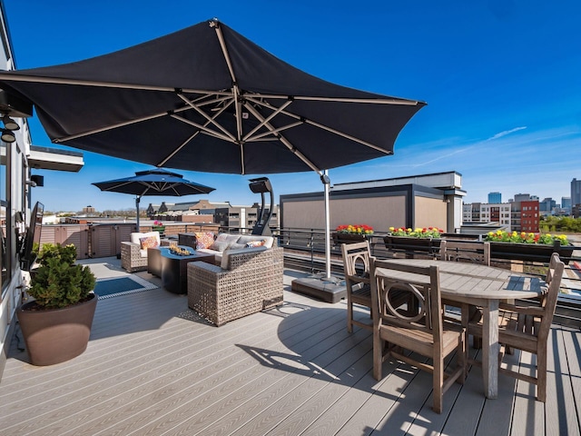 758 N 6th St, Columbus, OH 43215 - wooden deck with outdoor dining area, an outdoor living space, and a city view