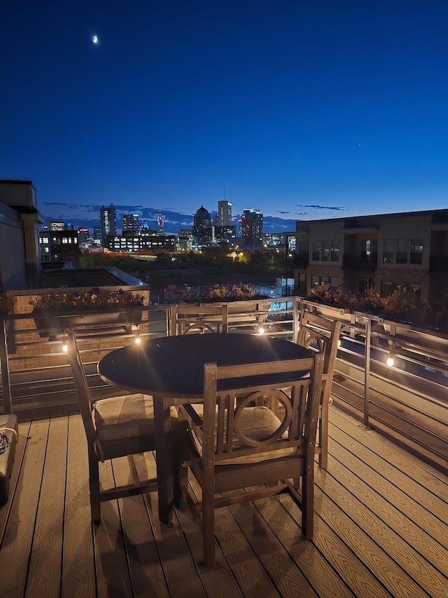 758 N 6th St, Columbus, OH 43215 - deck at twilight featuring a view of city lights and outdoor dining area