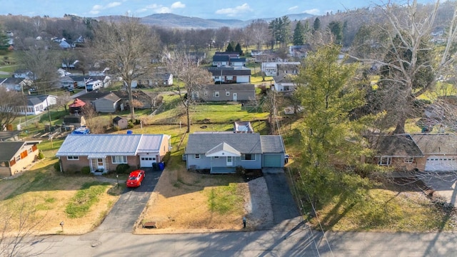 birds eye view of property with a mountain view