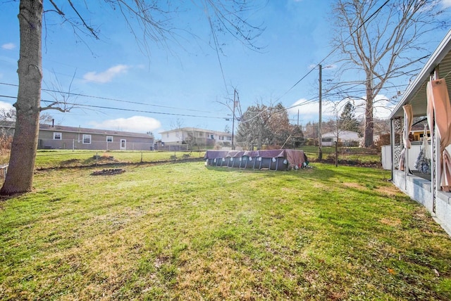 view of yard featuring a covered pool