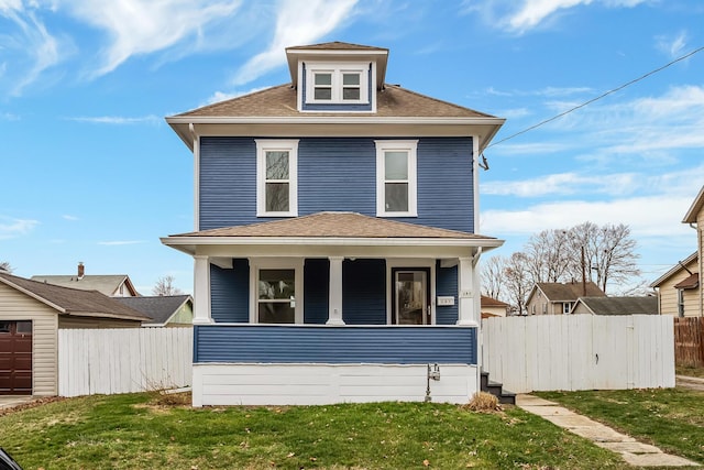 view of front of home with a porch and a front lawn