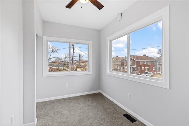 unfurnished room featuring carpet flooring and ceiling fan