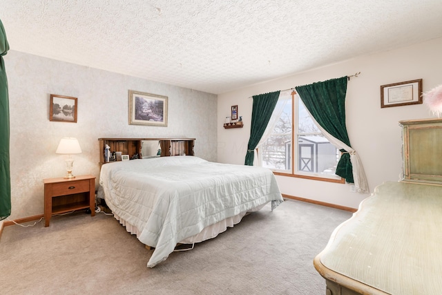 carpeted bedroom featuring a textured ceiling