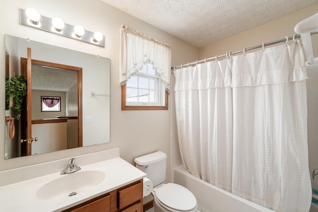 full bathroom featuring vanity, shower / bath combo, a textured ceiling, and toilet