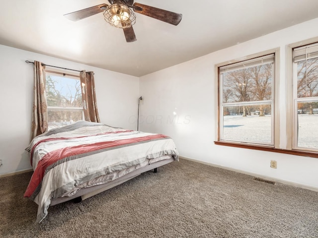 carpeted bedroom with ceiling fan