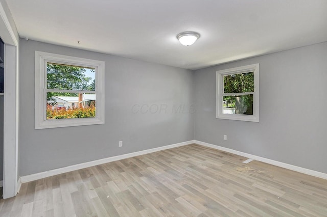 empty room featuring light hardwood / wood-style floors