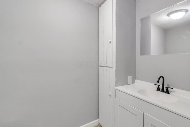 bathroom featuring vanity and a textured ceiling