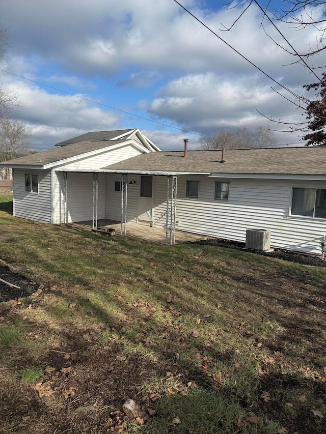 rear view of property with a yard and a patio