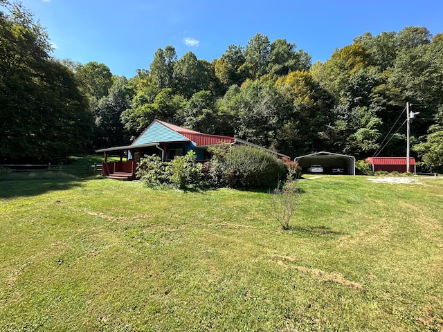 view of yard with a carport