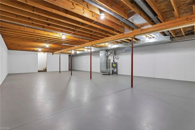 basement with heating unit and electric water heater